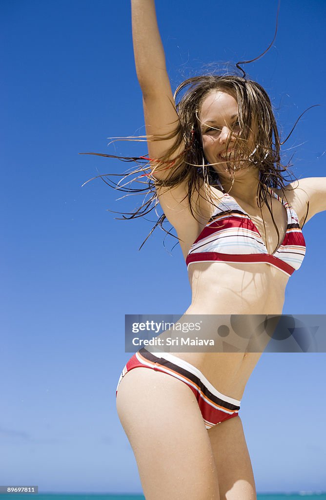 Teenage Girl Jumping On Beach High-Res Stock Photo - Getty Images