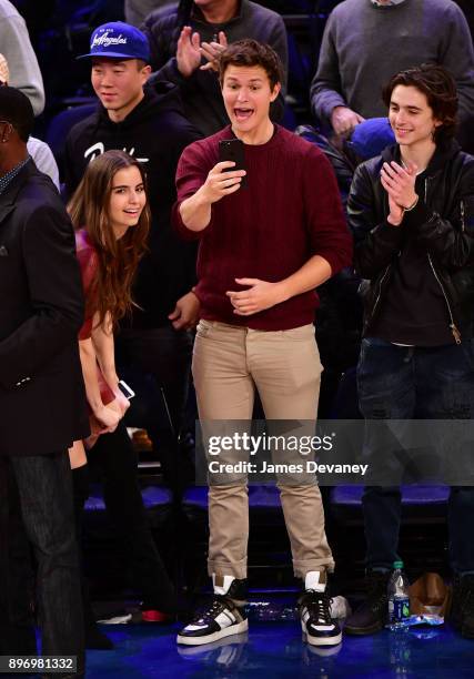 Violetta Komyshan, Ansel Elgort and Timothee Chalamet attend the New York Knicks Vs Boston Celtics game at Madison Square Garden on December 21, 2017...