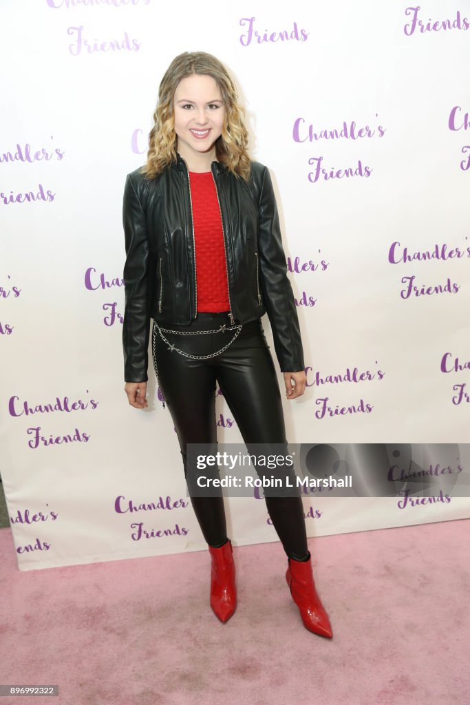 Isabella Acres attends Chandler's Friends Toy Drive and Wrapping
