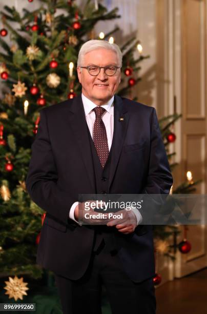 German President Frank-Walter Steinmeier poses for a photo after recording his annual Christmas television address to the nation on December 21, 2017...