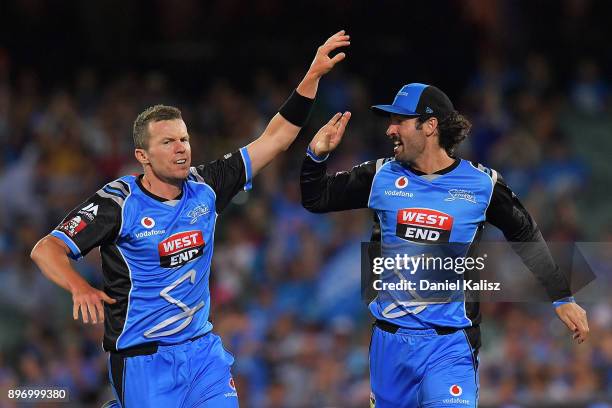 Peter Siddle of the Adelaide Strikers and Jono Dean of the Adelaide Strikers celebrate during the Big Bash League match between the Adelaide Strikers...