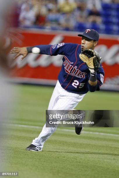 Alexi Casilla of the Minnesota Twins fields a ball against the Los Angeles Angels on August 2, 2009 at the Metrodome in Minneapolis, Minnesota. The...
