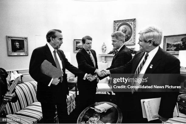 From left, American politicians US Senate Majority Leader Bob Dole, US Vice President Al Gore, US President Bill Clinton, and Speaker of the US House...