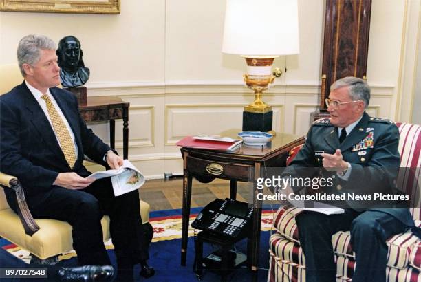 American politician US President Bill Clinton receives a briefing from the Chairman of the Joint Chiefs of Staff US Army General John Shalikashvili...