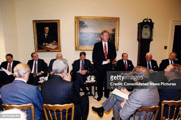American politician US President Bill Clinton consults with a bipartisan group of Congressional leadership in the White House's Roosevelt Room,...