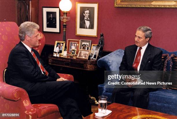 President Bill Clinton and Syrian Foreign Minister Farouk al-Sharaa talk together in the President's White House study, Washington DC, October 7,...