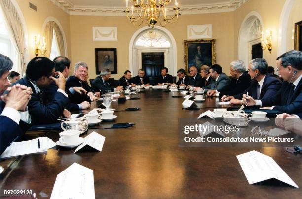 View of American politician US President Clinton and Russian President Boris Yeltsin , along with advisors, translators, and various business...