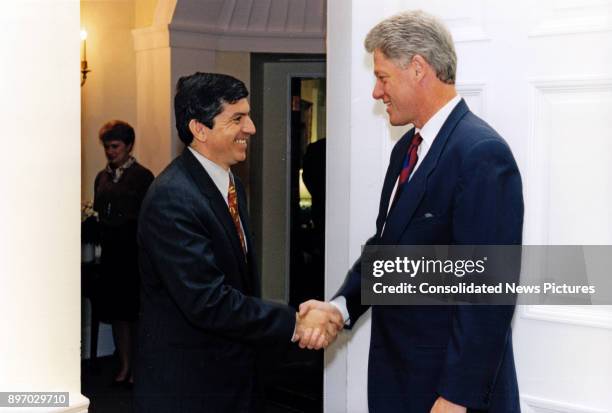 Secretary General of the Organization of American State Cesar Gaviria and US President Bill Clinton shake hands in the Oval office of the White...