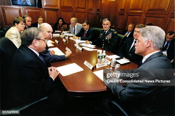 American politician US President Bill Clinton meets with his foreign policy advisors in the White House's Situation Room, Washington DC, August 12,...