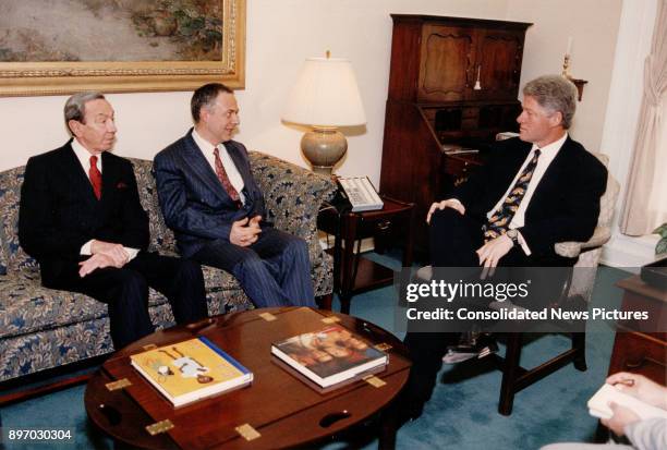 From left, US Secretary of State Warren Christopher, Russian Foreign Minister Andrei Kozyrev, and US President Bill Clinton talk together in the...