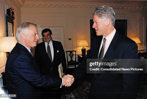 British politician Governor of Hong Kong Chris Patten and American politician US President Bill Clinton shake hands in the White House's Map Room,...