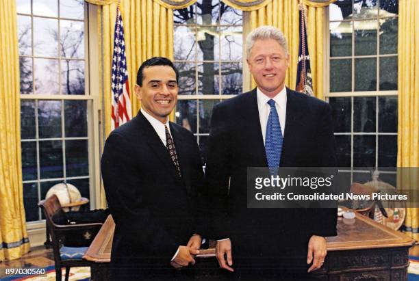 American politicians California State Assembly Speaker Antonio Villarraigosa and US President Bill Clinton pose together in the White House's Oval...