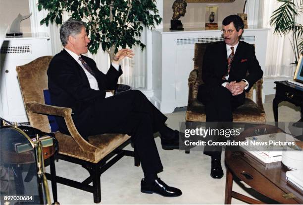 President Bill Clinton and Irish Deputy Prime Minister Dick Spring talk together in Vice President Al Gore's office in the White House's West Wing,...