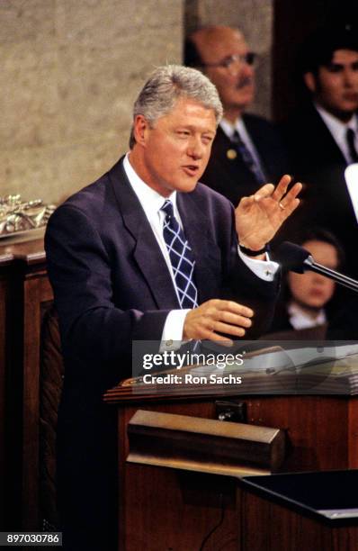 American politician US President Bill Clinton gestures as he delivers his annual State of the Union Address to a joint session of the United States...