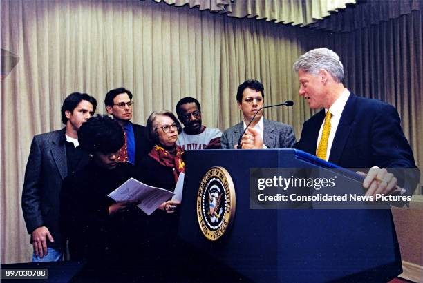 American politician US President Bill Clinton prepares for his State of the Union address with members of his staff in the White House, Washington...