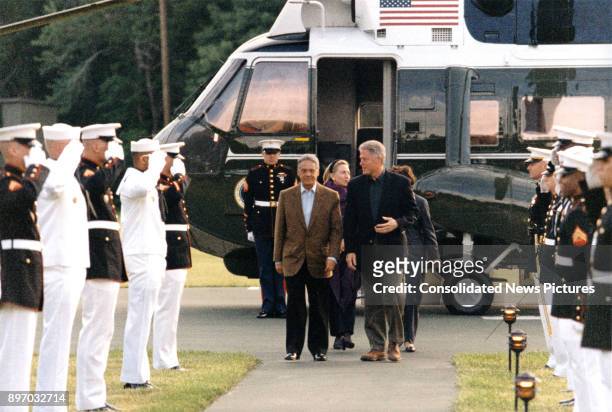Brazilian President Fernando Henrique Cardoso is escorted by US President Bill Clinton as they arrive at Camp David, near Thurmont, Maryland, June 7,...