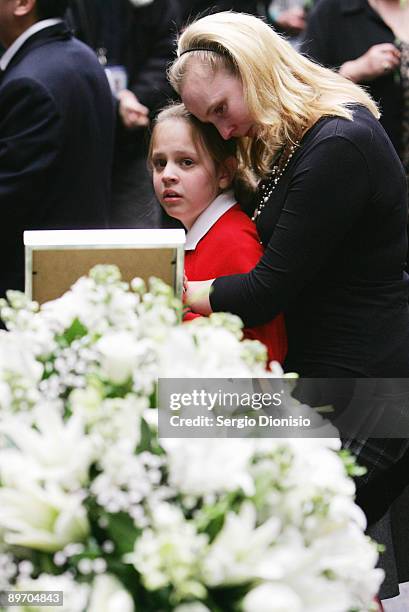 Students from Cheltenham Girls High school comfort each other during the public funeral for the murdered members of the Lin family, at the Badgery...