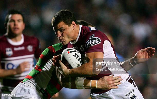 Anthony Watmough of the Sea Eagles takes on the defence during the round 22 NRL match between the Manly Warringah Sea Eagles and the South Sydney...