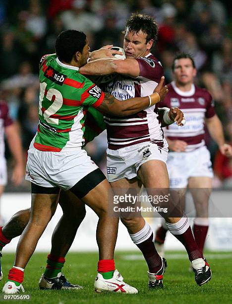 Josh Perry of the Sea Eagles takes on the defence during the round 22 NRL match between the Manly Warringah Sea Eagles and the South Sydney Rabbitohs...