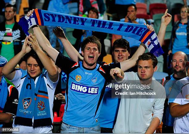 Sydney FC fans celebrate after winning round one A-League match between the North Queensland Fury and Sydney FC at Dairy Farmers Stadium on August 8,...