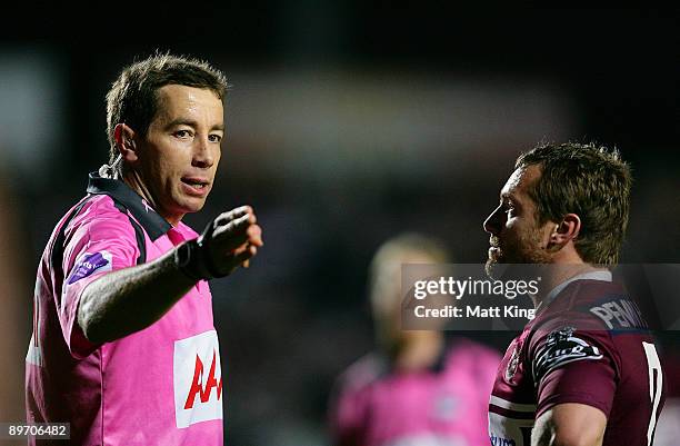 Referee Ben Cummins explains a decision to Sea Eagles captain Matt Orford during the round 22 NRL match between the Manly Warringah Sea Eagles and...