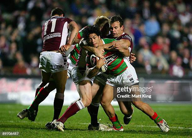 Issac Luke of the Rabbitohs takes on the defence during the round 22 NRL match between the Manly Warringah Sea Eagles and the South Sydney Rabbitohs...
