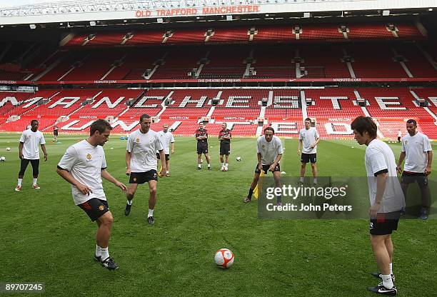 Michael Owen, John O'Shea, Dimitar Berbatov and Ji-Sung Park of Manchester United in action during an open training session in aid of the Manchester...
