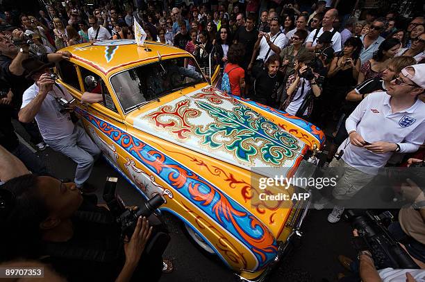 Replica of John Lennon's customised Rolls Royce car arrives on Abbey Road on August 8, 2009 during an event to celebrate 40 years to the minute since...