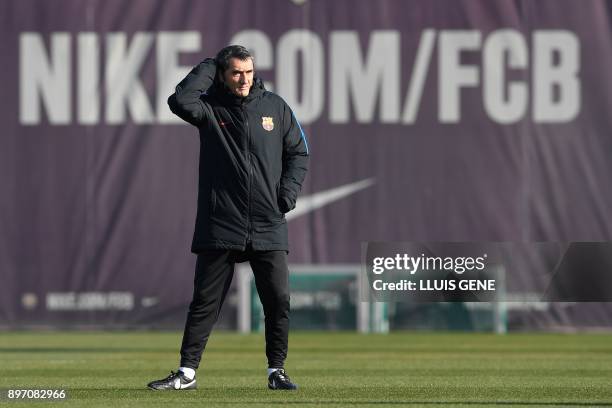 Barcelona's coach Ernesto Valverde attends a training session at the Sports Center FC Barcelona Joan Gamper in Sant Joan Despi, near Barcelona on...