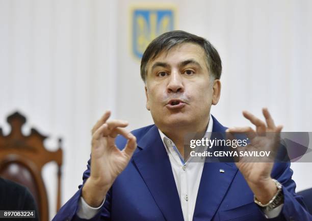 Former Georgian president Mikheil Saakashvili gestures as he speaks to the media after attending his appeal hearing at a courthouse in Kiev on...