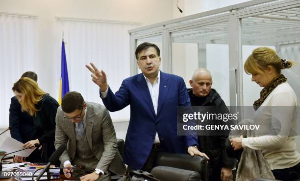 Former Georgian president Mikheil Saakashvili gestures as he speaks to the media after attending his appeal hearing at a courthouse in Kiev on...