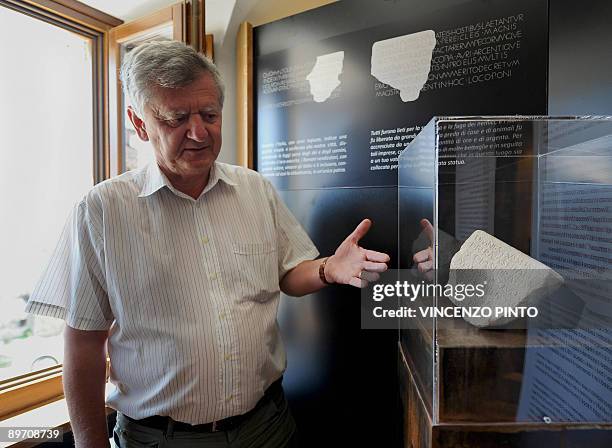 Professor Filippo Coarelli poses beside a stone found in the house of Roman Emperor Vespasian in the village of Cittareale, some 70 kms from Rome....