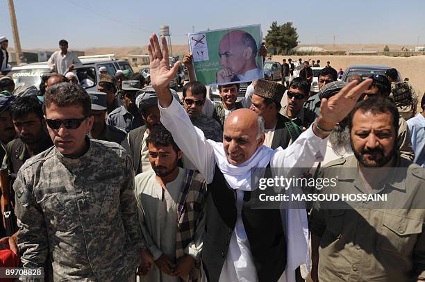 Afghan presidential candidate and former finance minister Ashraf Ghani capmpaigns in Maymana city of the northern province Faryab on August 8, 2009....
