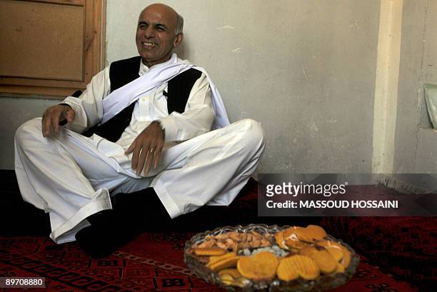 Afghan presidential candidate and former finance minister Ashraf Ghani sits at a campaign centre in Maymana city of the northern province Faryab on...