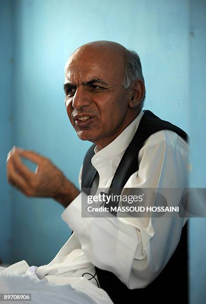 Afghan presidential candidate and former finance minister Ashraf Ghani talks during his campaign trip to Maymana city of the northern province Faryab...