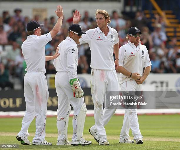 Stuart Broad of England celebrates the wicket of Stuart Clark of Australia with team mates during day two of the npower 4th Ashes Test Match between...