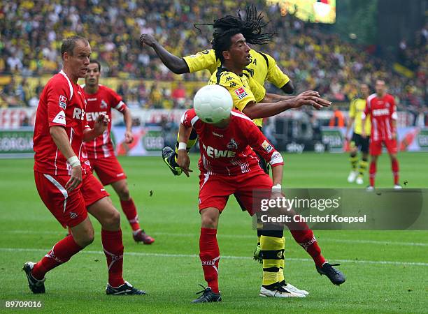 Miso Brecko of Koeln and Lucas Barrios of Dortmund go up for a header during the Bundesliga match between Borussia Dortmund and 1. FC Koeln at the...