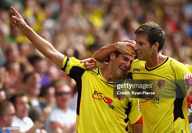 Danny Graham is congratulated by Mike Williamson of Watford after scoring his team's first goal during the Coca Cola Championship match between...