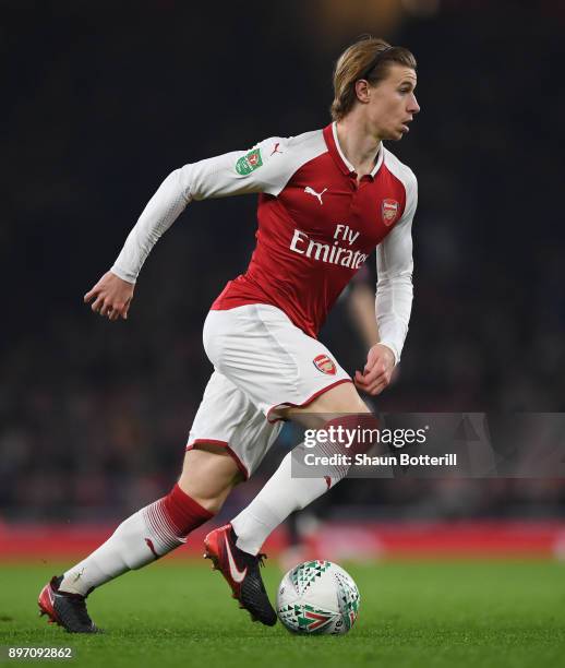 Ben Sheaf of Arsenal runs with the ball during the Carabao Cup quarter final match between Arsenal and West Ham United at Emirates Stadium on...