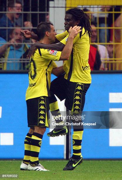 Tinga and Tamás Hajnal of Dortmund celebrate their team's first goal during the Bundesliga match between Borussia Dortmund and 1. FC Koeln at the...