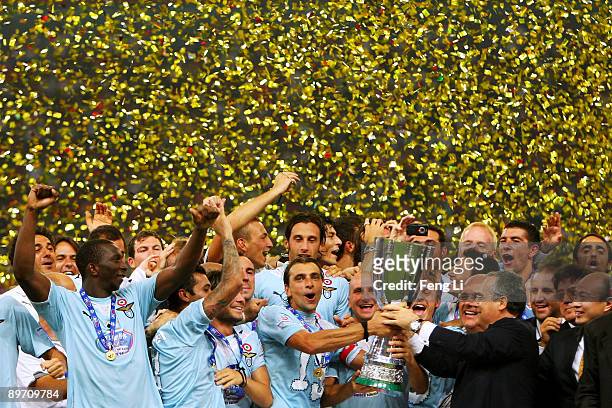 Players of Lazio celebrate with the cup after victory in the Beijing 2009 Supercup match between Inter Milan and Lazio at the Birds Nest on August 8,...