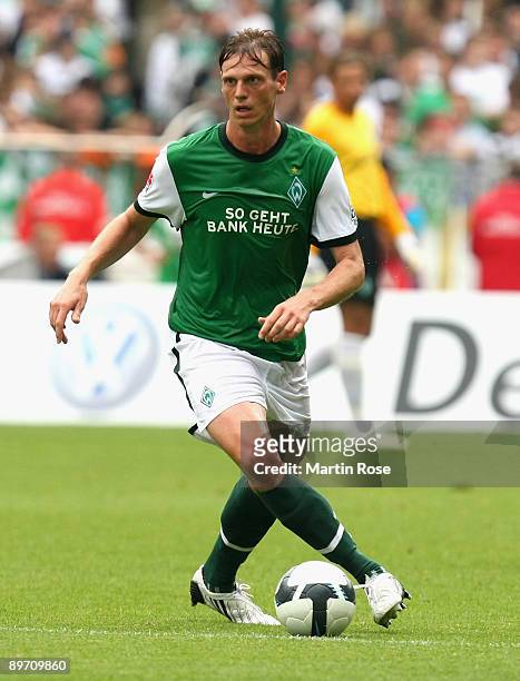 Tim Borowski of Bremen runs with the ball during the Bundesliga match between Werder Bremen and Eintracht Frankfurt at the Weser stadium on August 8,...