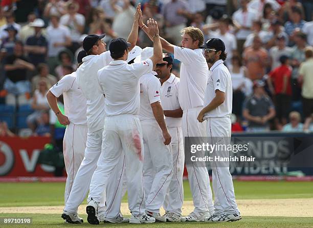 Stuart Broad of England celebrates the wicket of Mitchell Johnson of Australia with team matesduring day two of the npower 4th Ashes Test Match...