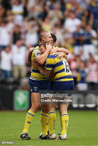 Try scorer Chris Hicks of Warrington comforts team mate Lee Briers as cries with joy on the sound of the final whistle during the semi-final match of...