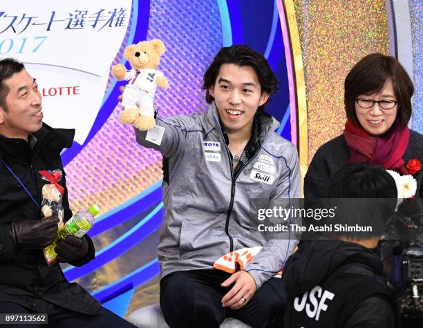 Takahito Mura reacts at the kiss and cry after competing in the Men's Singles Short Program during day two of the 86th All Japan Figure Skating...