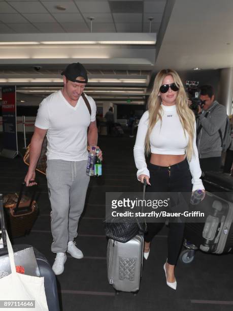 Kim Zolciak and Kroy Biermann are seen at Los Angeles International Airport on December 21, 2017 in Los Angeles, California.