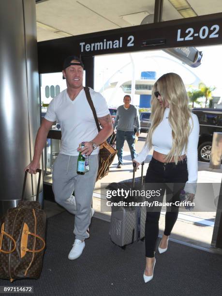 Kim Zolciak and Kroy Biermann are seen at Los Angeles International Airport on December 21, 2017 in Los Angeles, California.