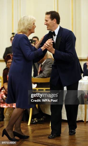 Camilla, Duchess of Cornwall, President of the National Osteoporosis Society, dances with 'Strictly Come Dancing' professional dancer Brendan Cole as...