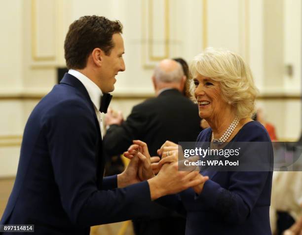 Camilla, Duchess of Cornwall, President of the National Osteoporosis Society, dances with 'Strictly Come Dancing' professional dancer Brendan Cole as...