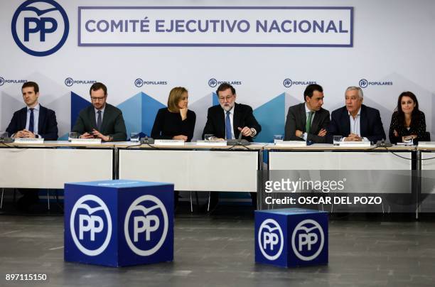 Spanish Prime Minister Mariano Rajoy and her Spanish Minister of Defence Maria Doroles de Cospedal attend a Popular Party meeting of the national...